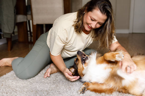 istock Woman playing with her dog 2193791744