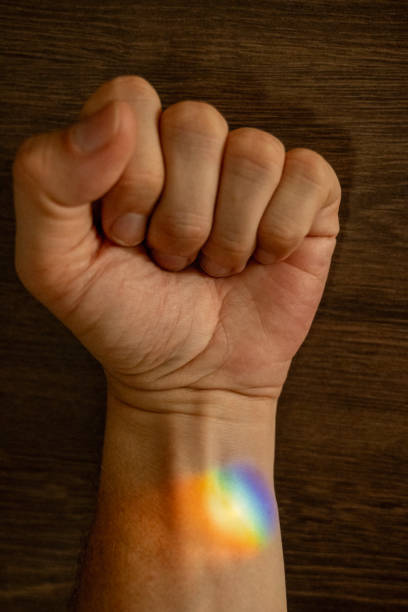 Clenched Fist with Rainbow Light on Wrist