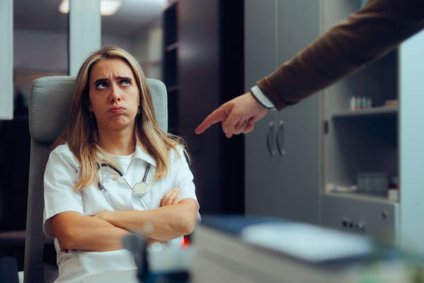 istock Man Pointing to a Doctor Accusing of Malpractice 2193796604