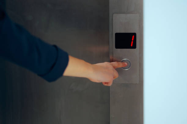 istock Hand of a Person Pressing the Button in an Elevator 2193798295