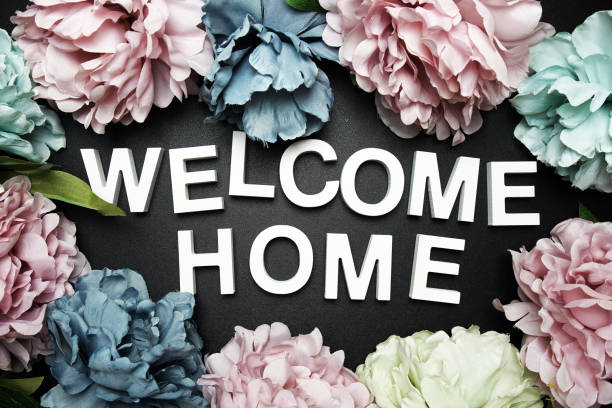 istock Welcome Home alphabet letter with flower decoration on black background 2193798752