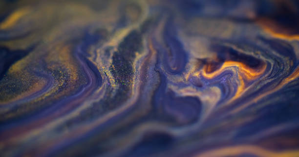 istock Glitter fluid splash blur ink mix blue yellow flow 2193799393