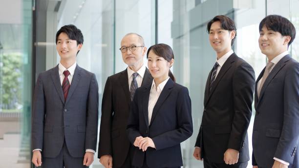 istock Asian business person standing with a smile 2193800656