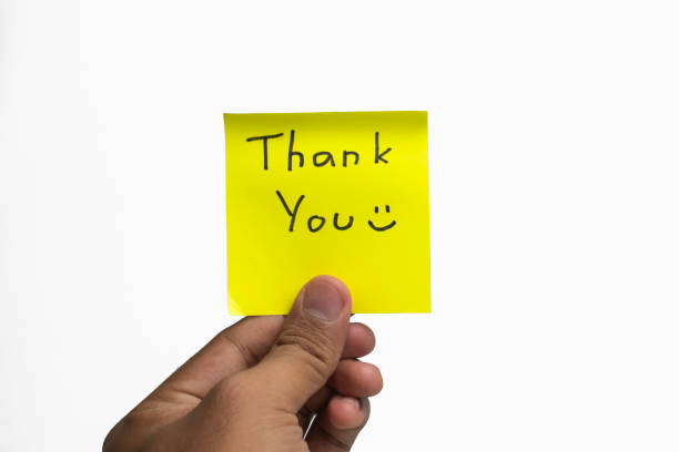 istock man hand holding thank you handwritten words on white background 2193809645
