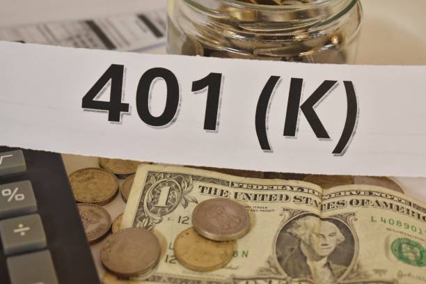 istock 401k plan with a coins, bank bills and calculator. 2193809646