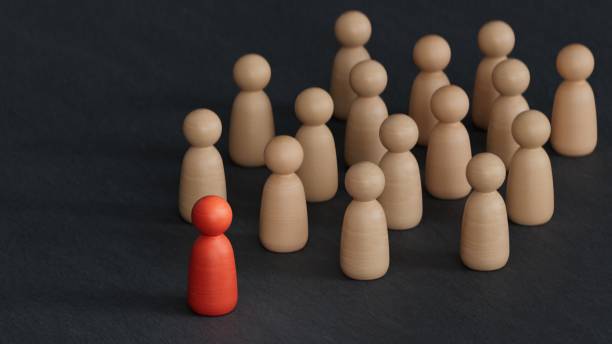 istock Leadership concept with chess pawn illustration. Emerging leader within employess.3D rendering on black background. 2193809978