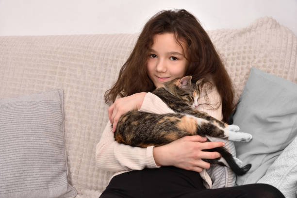istock Young girl playing with her kitten 2193812717