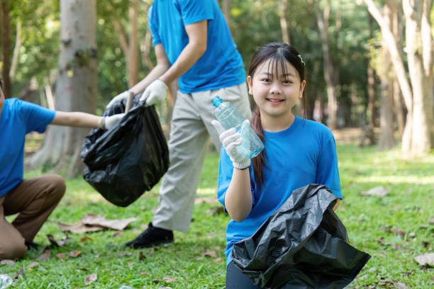 istock Community clean-up event local park volunteer activity green environment close up view environmental awareness 2193813081