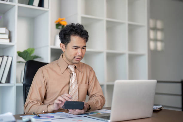 istock Business professional engaging with technology in modern office informal work environment digital communication concept 2193813131