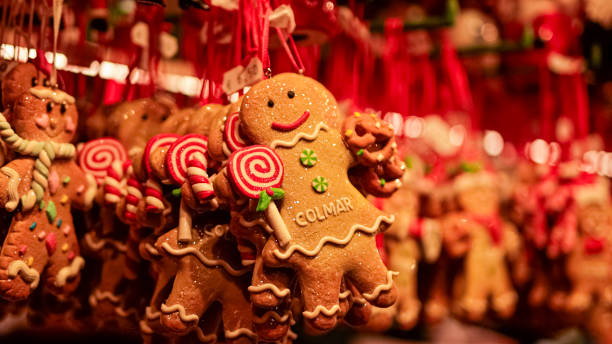Festive Gingerbread Cookies Hanging At Colmar Christmas Market, Decorated With Holiday Designs, Capturing Alsace's Christmas Spirit