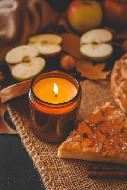 istock Candle and homemade apple pie, autumn mood 2193814851
