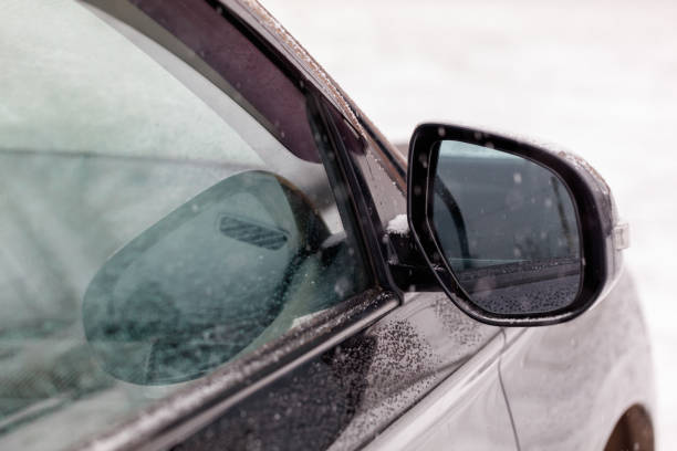 istock A car's side view mirror is fogged up 2193814879