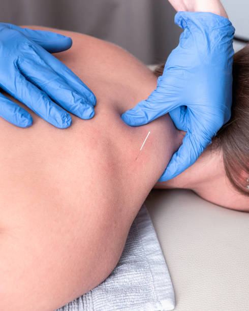 istock Physiotherapist treats a patient 2193815698