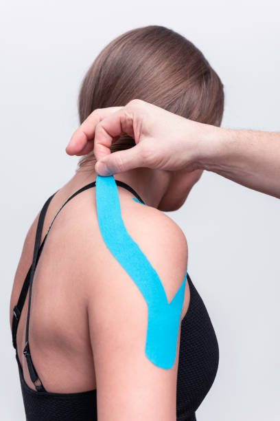 istock Physiotherapist treats a patient 2193815787