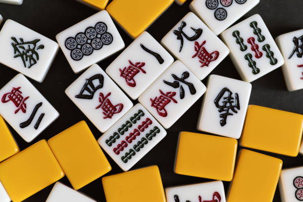 istock Mahjong tiles lined up on a black background 2193816431