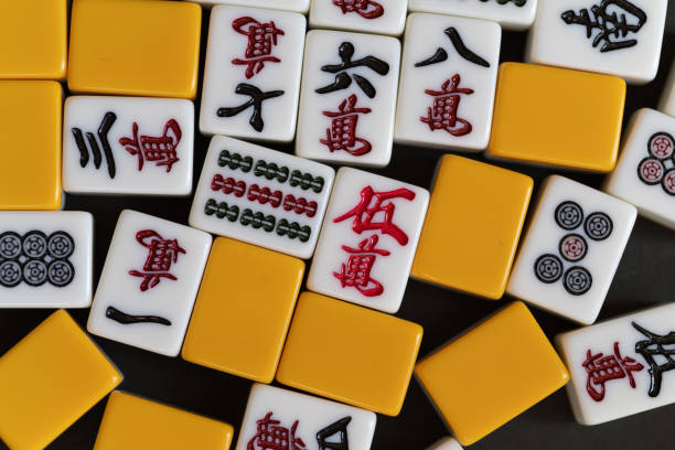 istock Mahjong tiles lined up on a black background 2193816460
