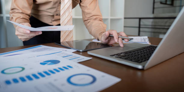 istock Businessman reviewing analytics and financial projections on a tablet, enhancing decision-making in a modern office 2193818515