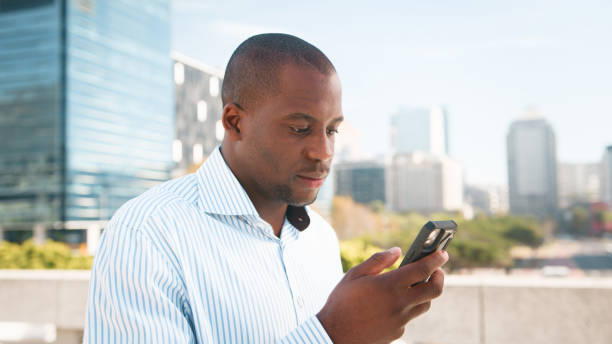 istock Professional Individual Engaging with Smartphone Device in Urban Environment 2193819272