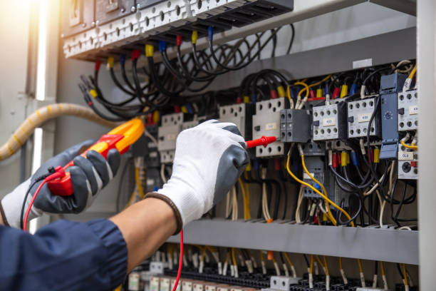 istock Checking the electrical system, an electrician is using an electric meter to check the electrical system at a control cabinet. for safety 2193819471