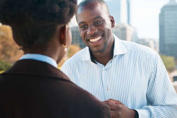 istock Two Friends Engaging in a Warm Conversation Outdoors in the City 2193820456