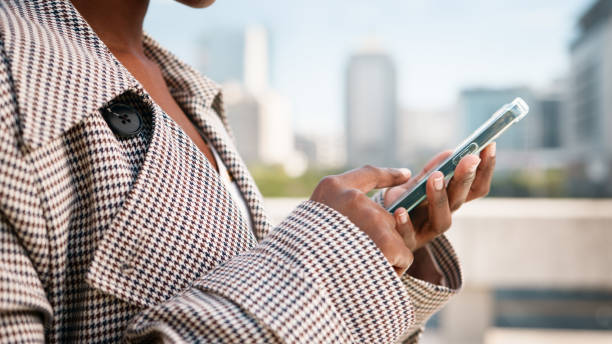 istock Close-Up of a Person Using a Smartphone in an Urban Setting 2193822292