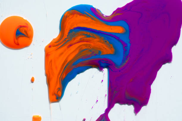 Abstract vibrant multi-color wet paint drops, swirl and splotch on white background. Purple orange and pink neon colors