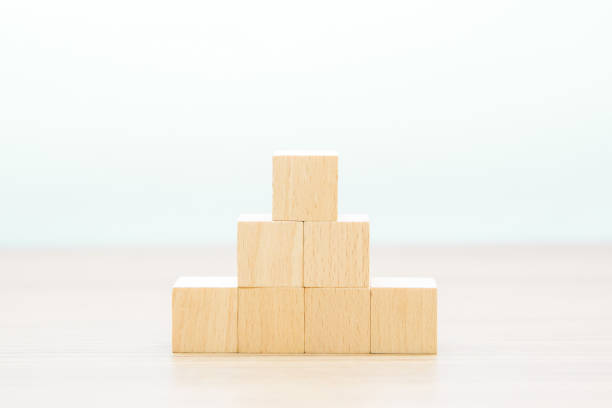 istock Cube wooden toy blocks are stacked in a pyramid shape without graphics 2193823563