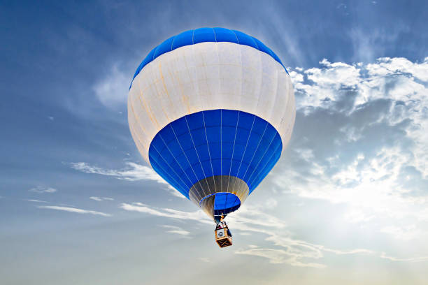 istock Hot air balloon flight over blue sky 2193828386