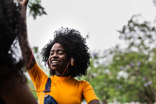 istock Young woman dancing on a public park 2193828779