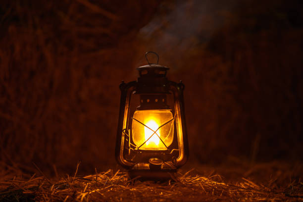 istock antique kerosene lamp with lights on a haystack in a barn at night 2193830719