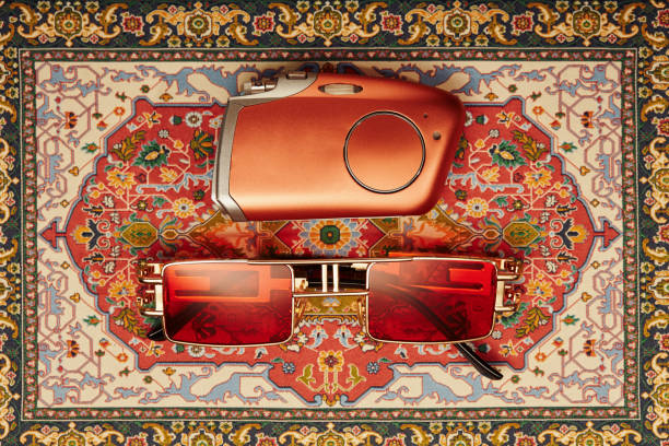 A set of sunglasses and a smartphone on a glass table for relaxation and relaxation