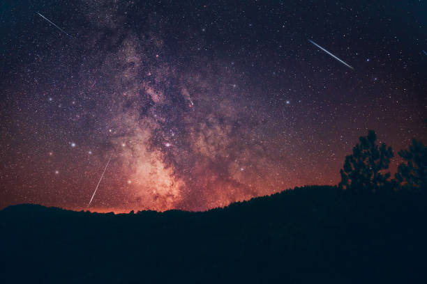 istock Milky Way stars and countryside tree silhouettes. 2193831519