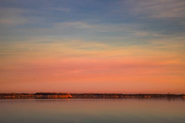 istock Lake Surface at Sunset with Golden Reflections and Gentle Sky Colors 2193831861