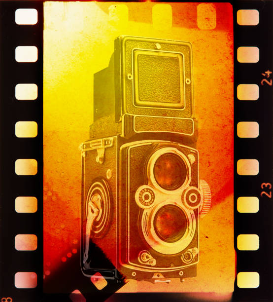 Film burn retro collage with twin lens reflex (TLR) medium format camera . Vintage noise, grain and scratches to add an analog touch