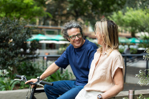 istock Mature aged couple chat in the park 2193833534