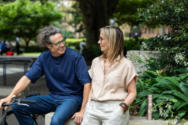 Mature aged couple chat in the park