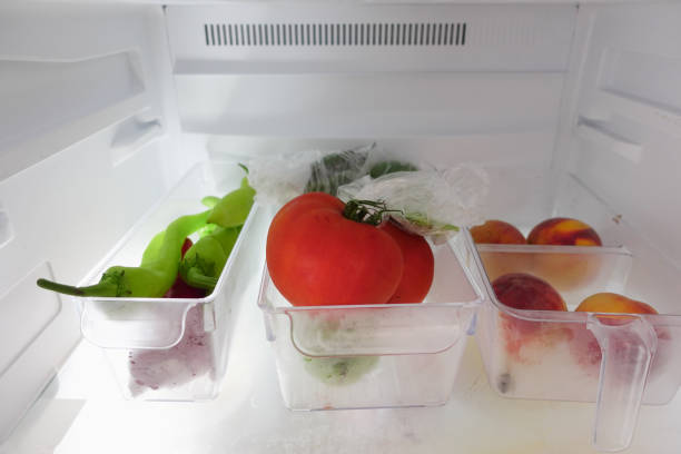 istock plastic containers with different fruits in a open fridge. 2193833712