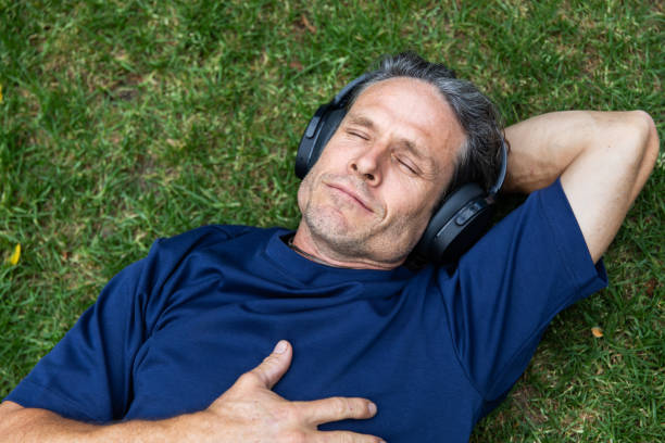 Mature aged man takes a mindful break in the park