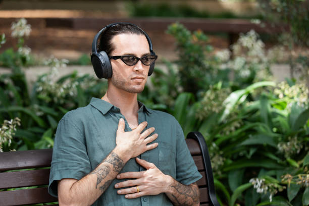 istock Young non-binary adult takes a mindful break in the park 2193834338