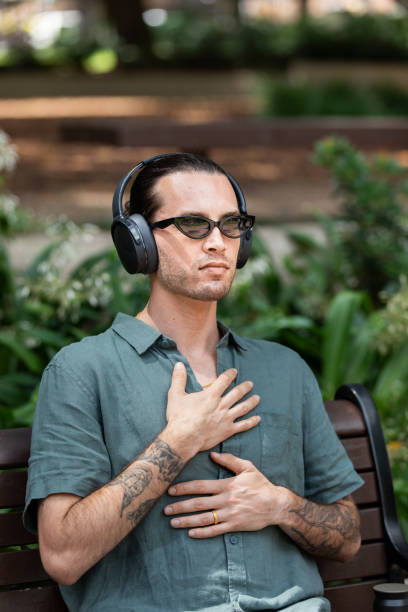 istock Young non-binary adult takes a mindful break in the park 2193834341