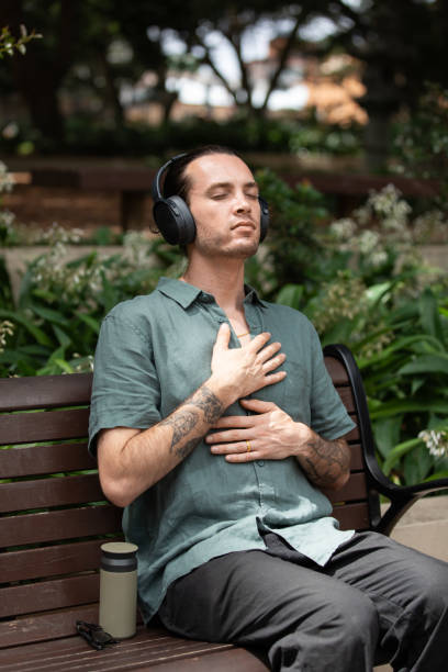 istock Young non-binary adult takes a mindful break in the park 2193834545