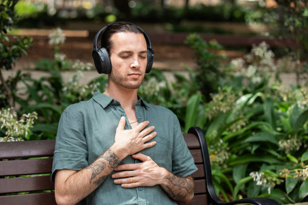 istock Young non-binary adult takes a mindful break in the park 2193834546