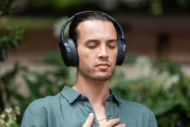 istock Young non-binary adult takes a mindful break in the park 2193834547