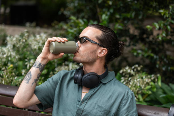 istock Young non-binary adult takes a mindful break in the park 2193834866