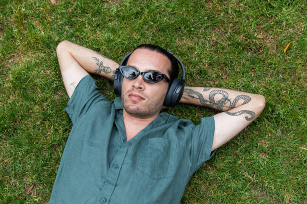 istock Young non-binary adult takes a mindful break in the park 2193835774