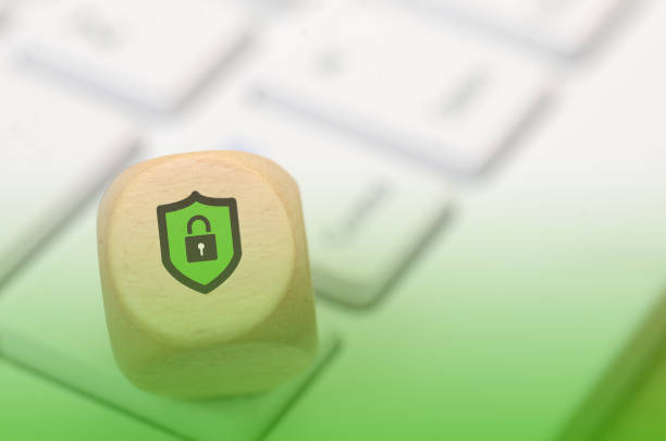 Cybersecurity Concept: Wooden Block with Lock and Shield Symbol for Data Protection