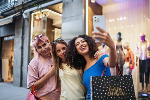 istock Three young women taking a selfie after christmas shopping 2193838121
