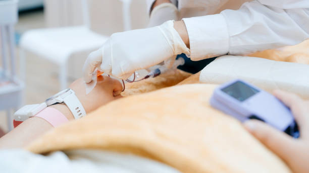 istock Medical worker carefully performs an injection on a patient, emphasizing hygiene and professional healthcare standards. 2193840065