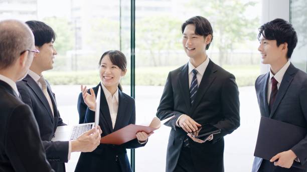 Business people talking in the lobby stock photo