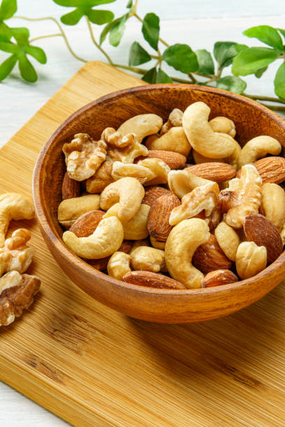 Assortment of nuts in wooden bowl